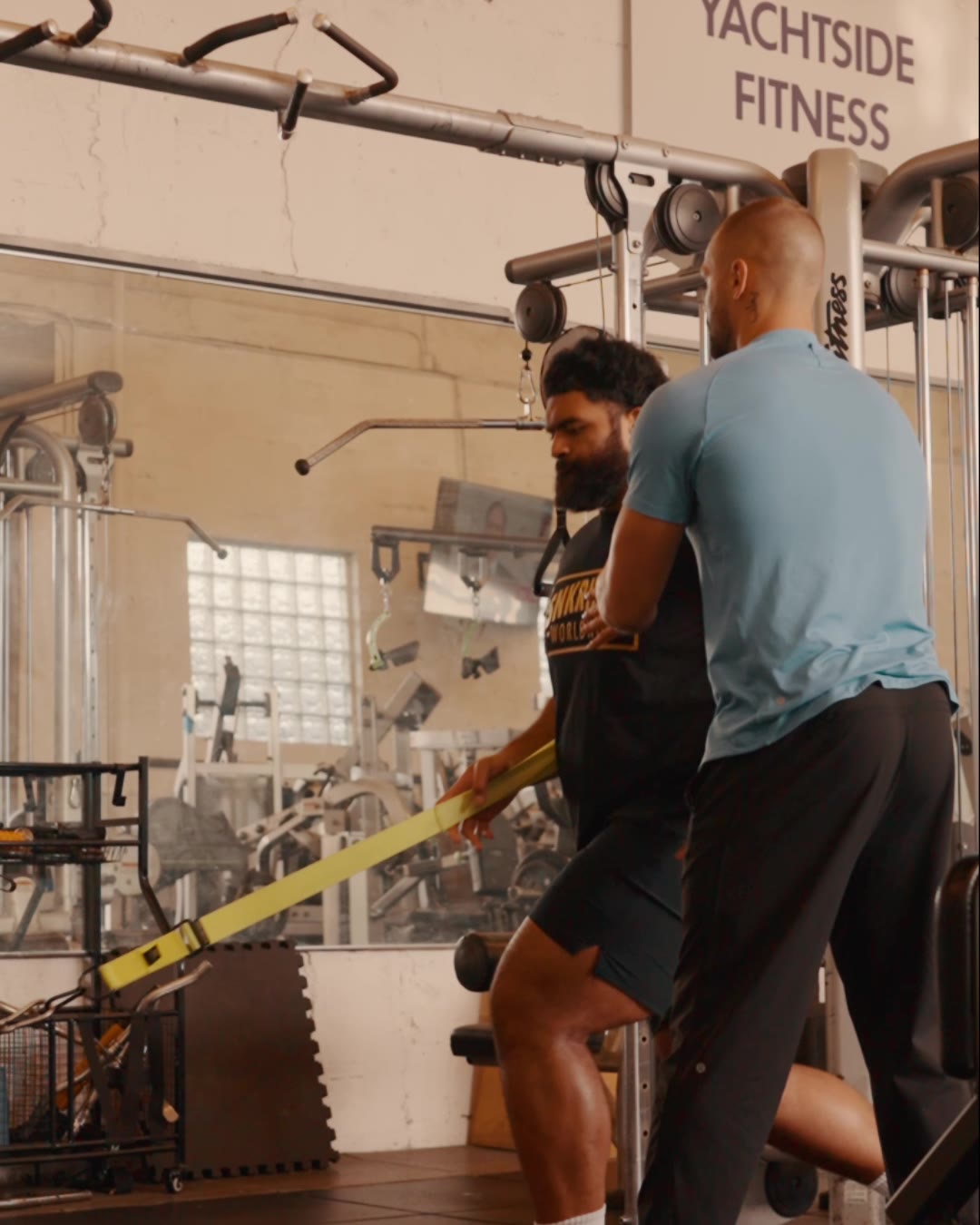 Dr. Evan Motlong coaching strength training